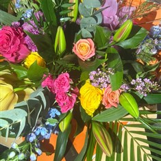Rose, lily and delphinium bouquet